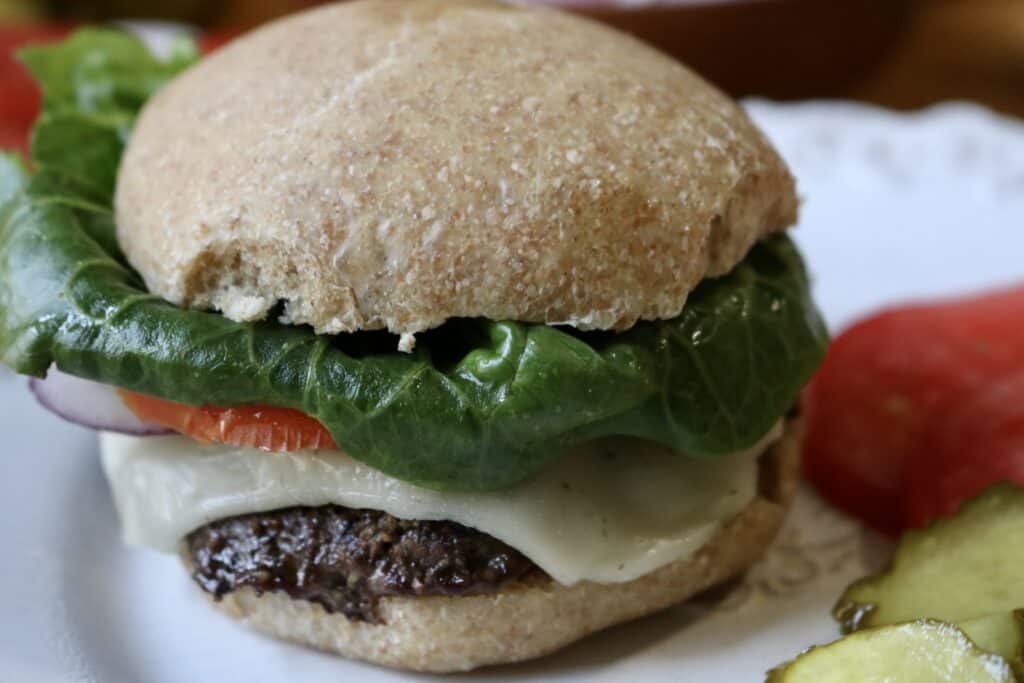 a hamburger fully made on a plate
