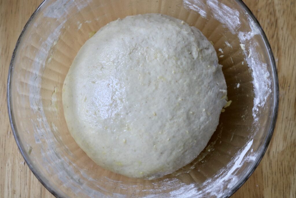 ball of dough in a glass bowl