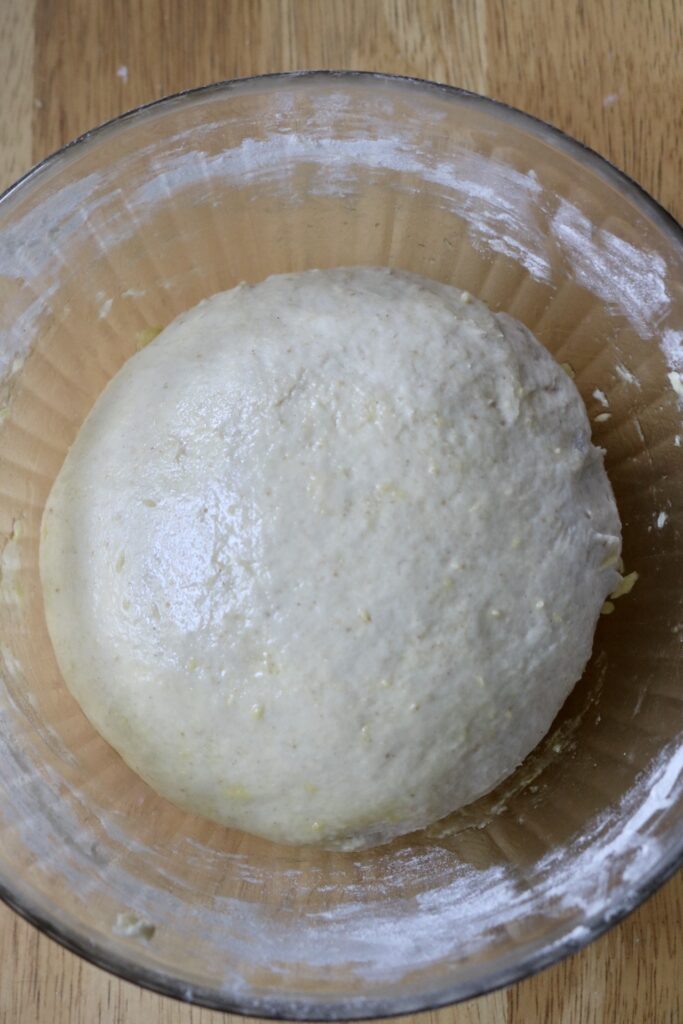 ball of dough in a glass bowl