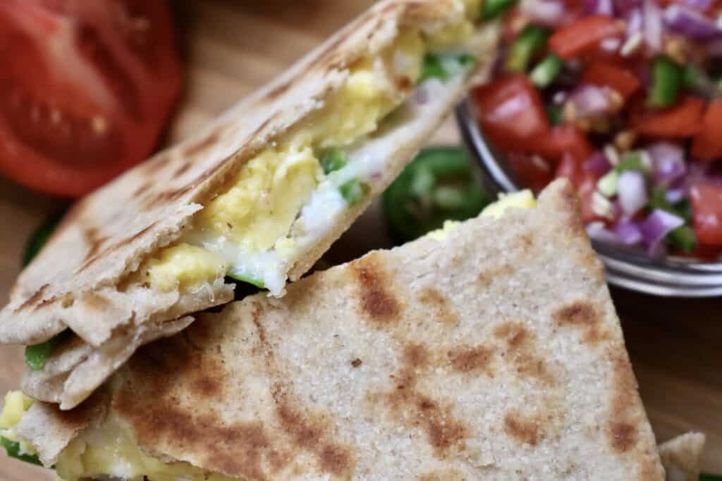 the best breakfast quesadillas arranged on counter with fresh salsa