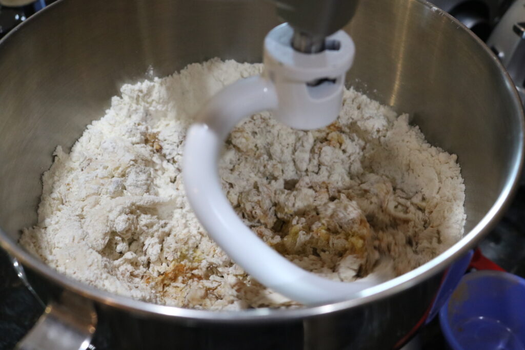 stand mixer with dough hook mixing dough
