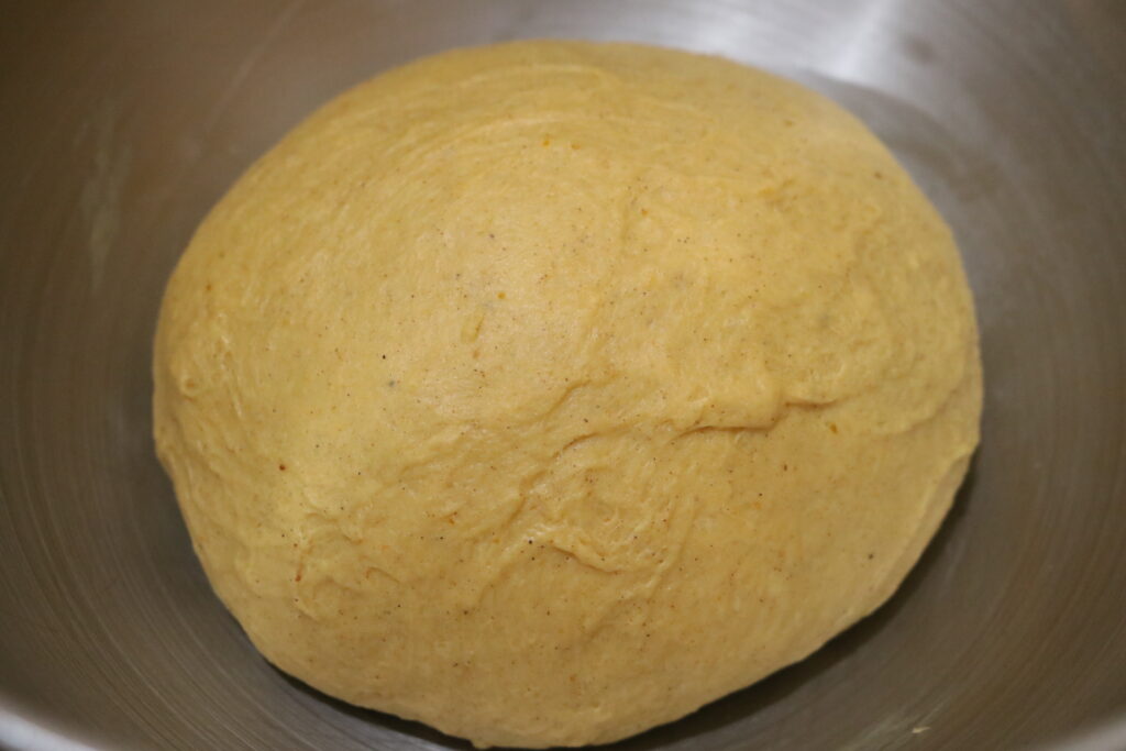 ball of dough in a metal bowl
