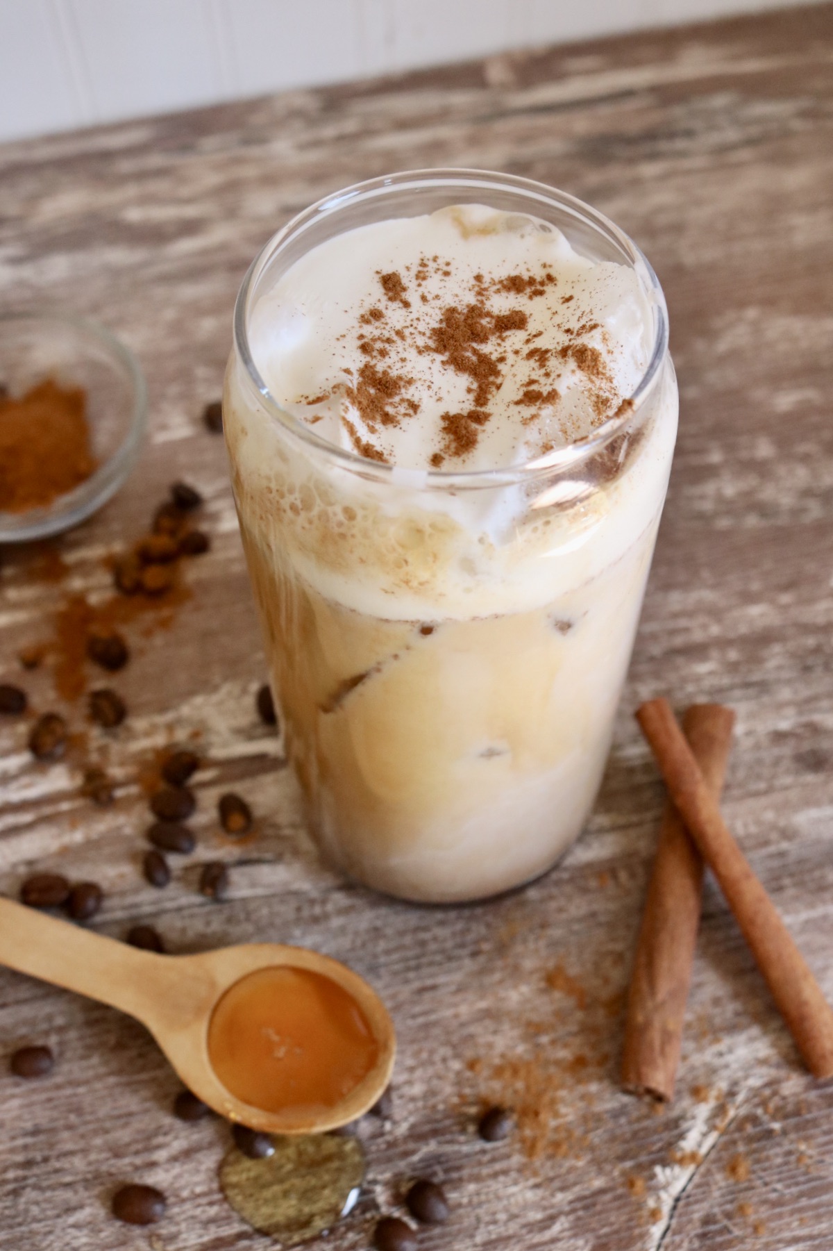 iced cinnamon honey latte with cold foam and cinnamon sprinkles