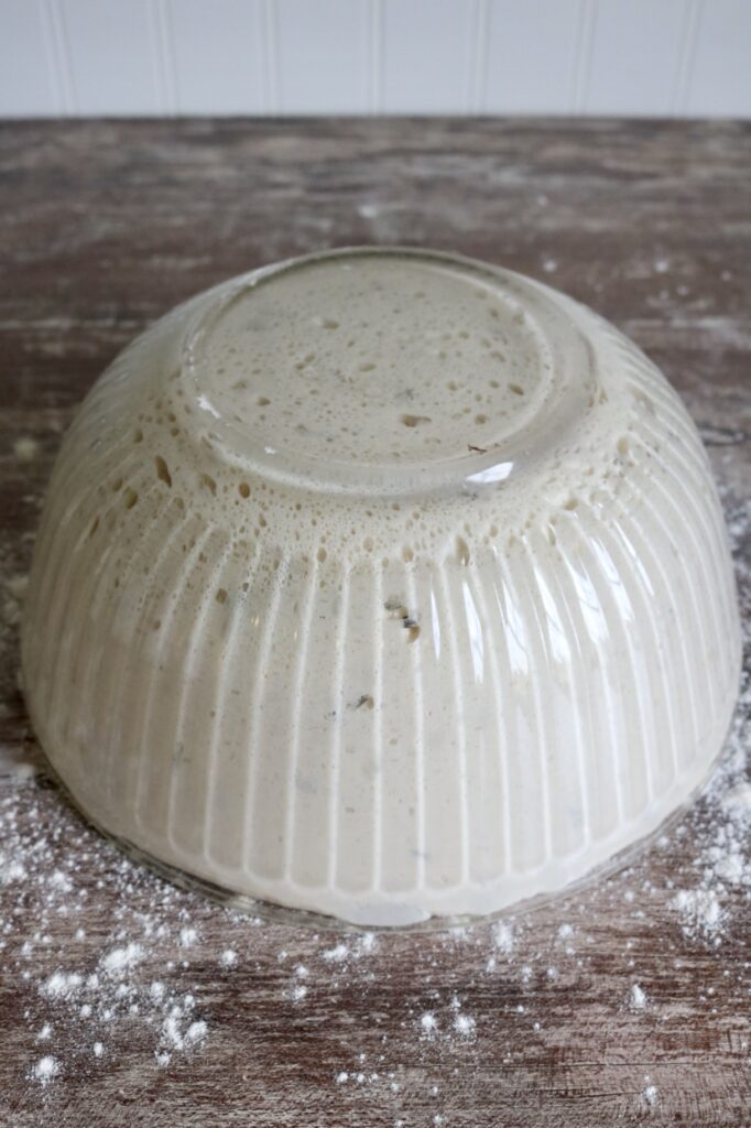 bowl of dough upside down on a countertop