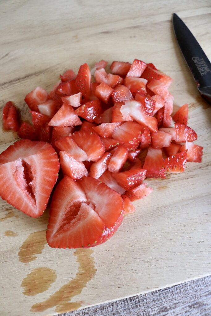 diced strawberries on a cutting board
