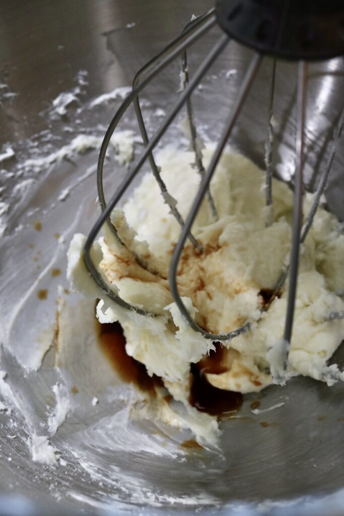 cream cheese and vanilla in a mixer bowl