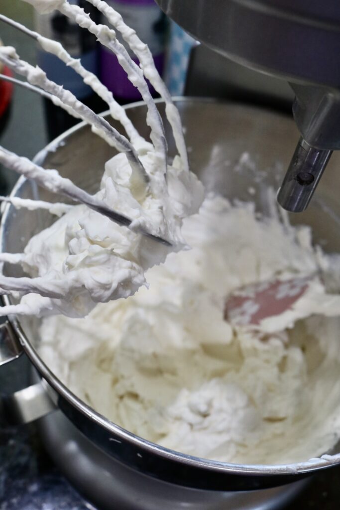 whipped cream frosting on a beater