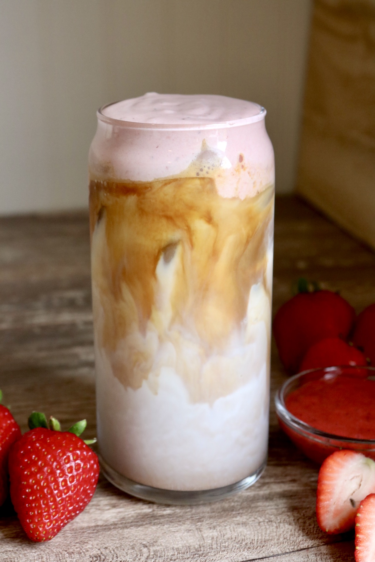iced latte with strawberry cold foam on top