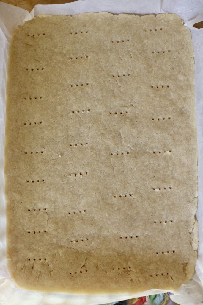 shortbread crust with fork holes in it