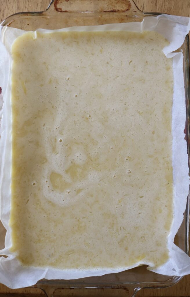 unbaked lemon bars in a pan
