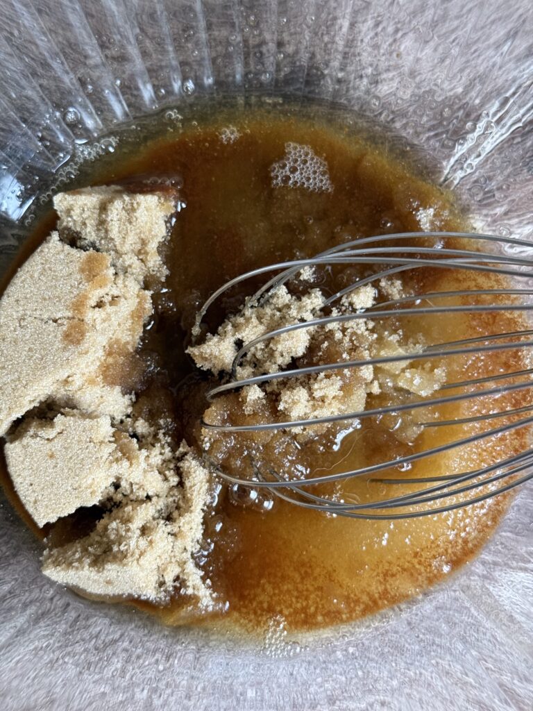 brown sugar and browned butte being whisked in a bowl