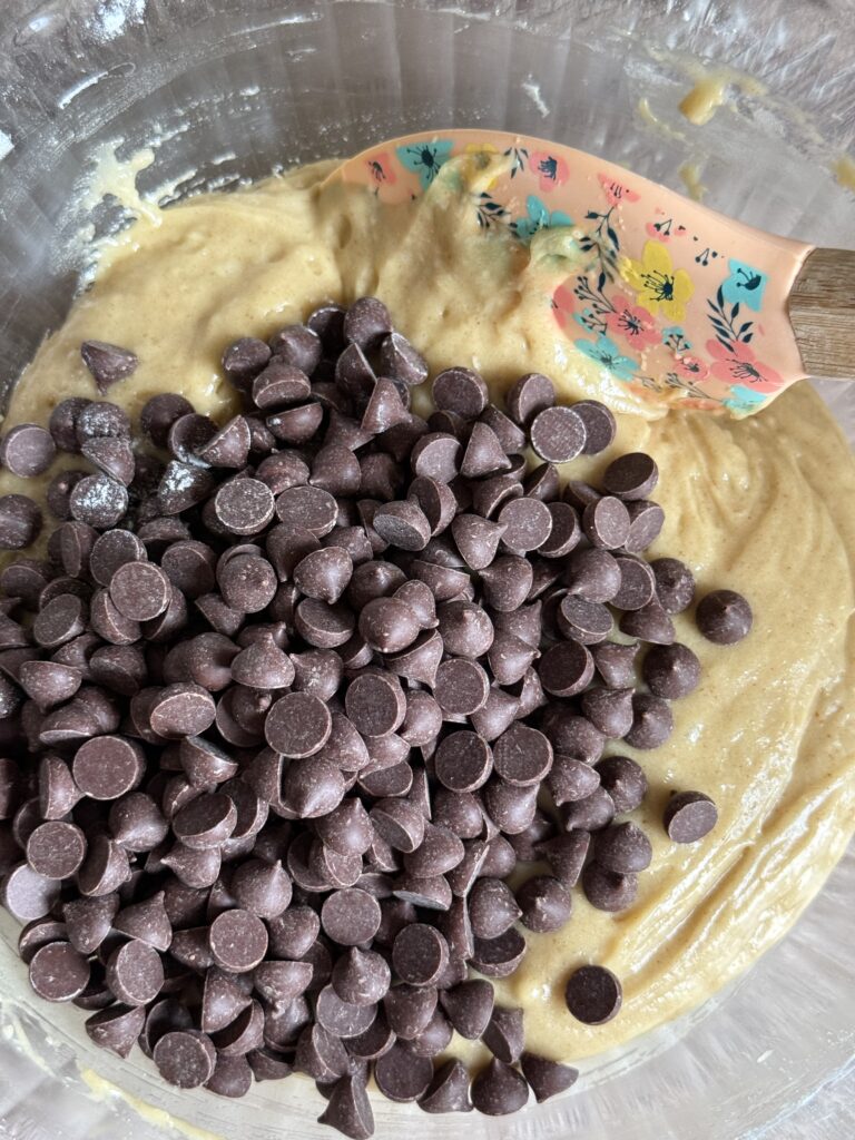 cookie batter with chocolate chips poured on top