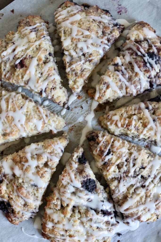 8 sourdough blackberry lemon sourdough scones drizzled with lemon glaze