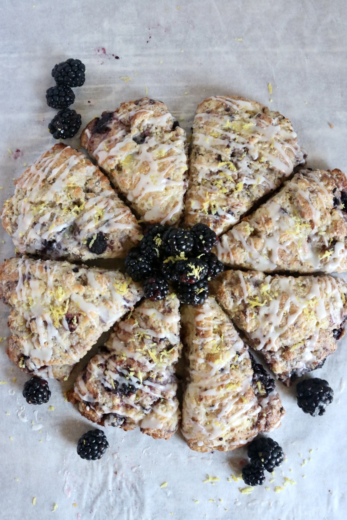 circle of blackberry lemon scones with fresh blackberries in the center of the circle