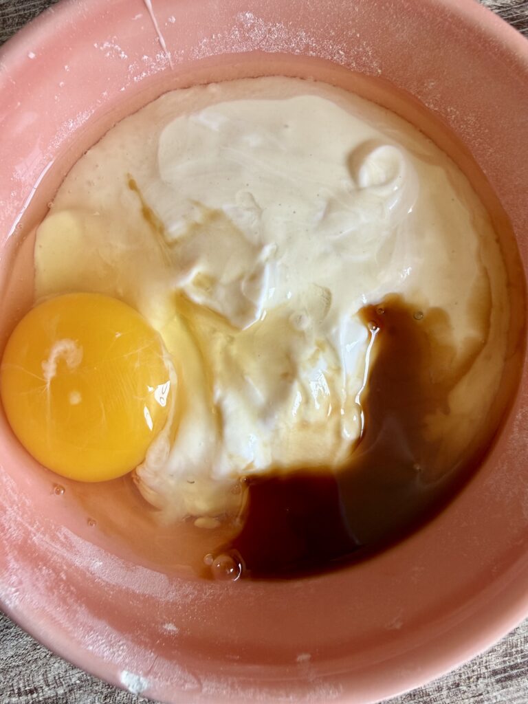 sourdough discard egg and vanilla in a pink bowl