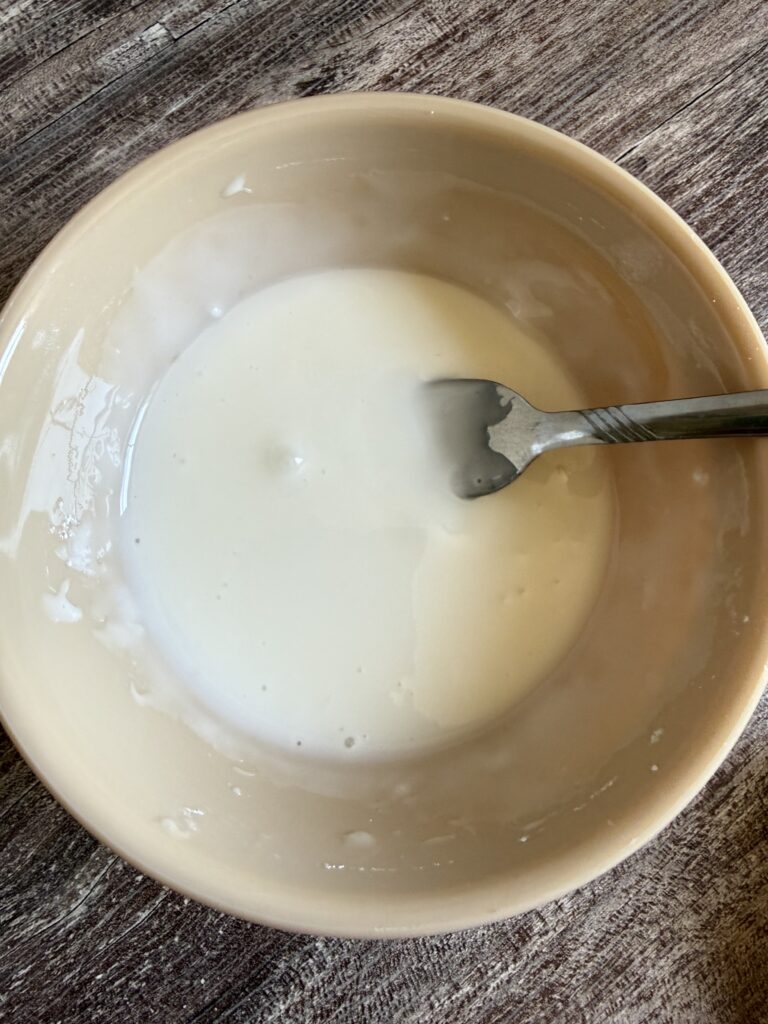 mixing glaze with a small fork