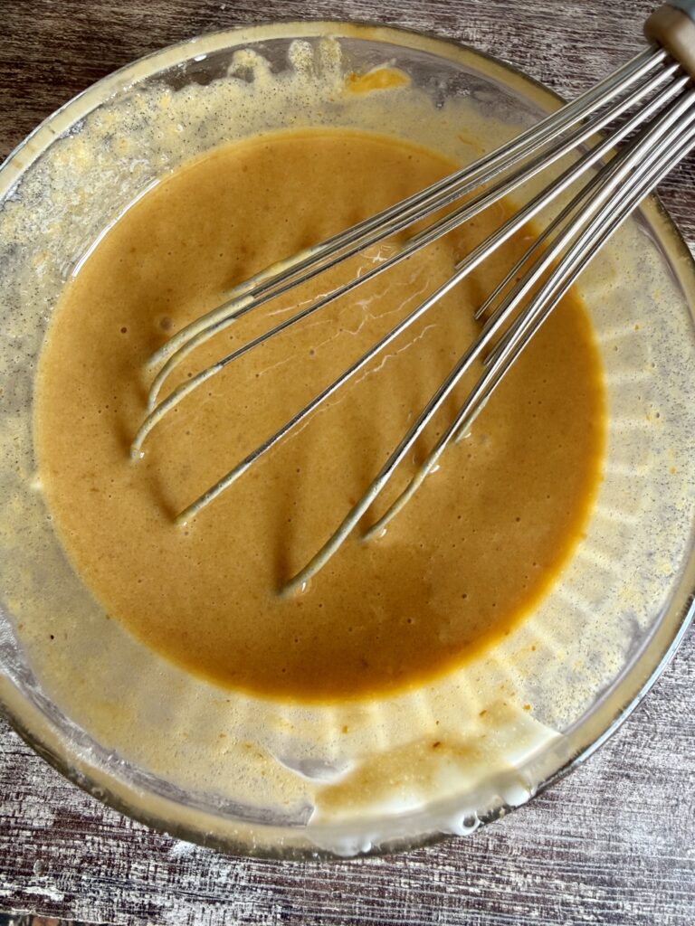 whisking pumpkin mixture 