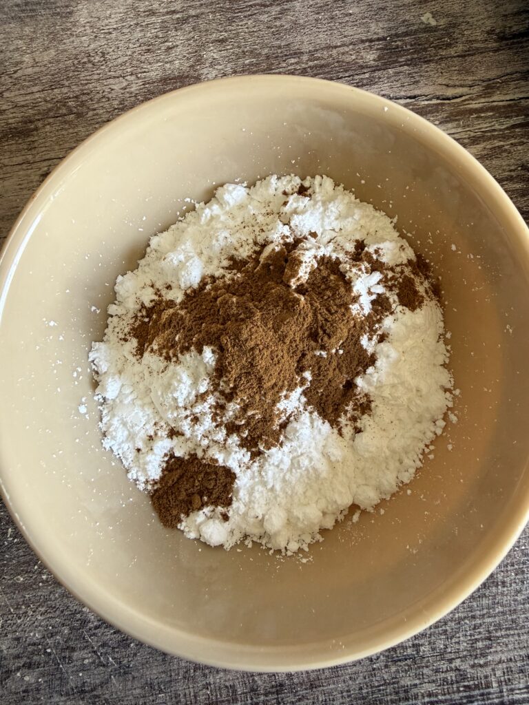 small brown bowl of powdered sugar and cinnamon