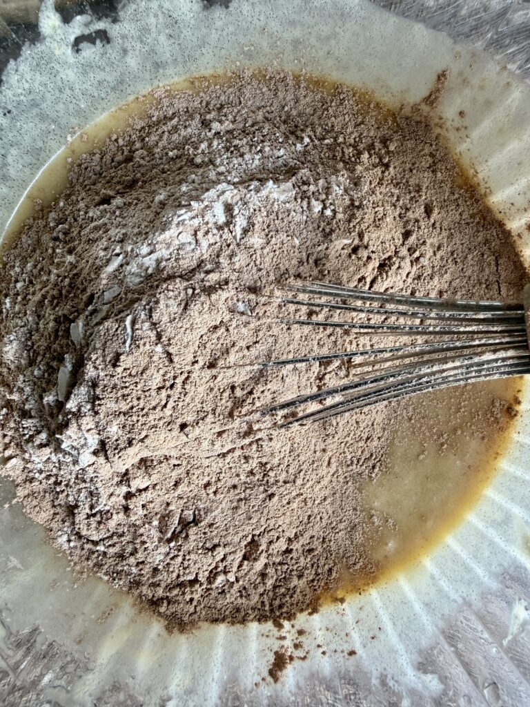 dry ingredients aded to wet in a bowl