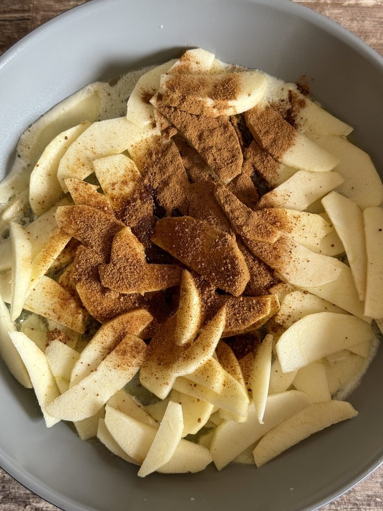 sliced apples, coconut sugar and cinnamon in a skillet