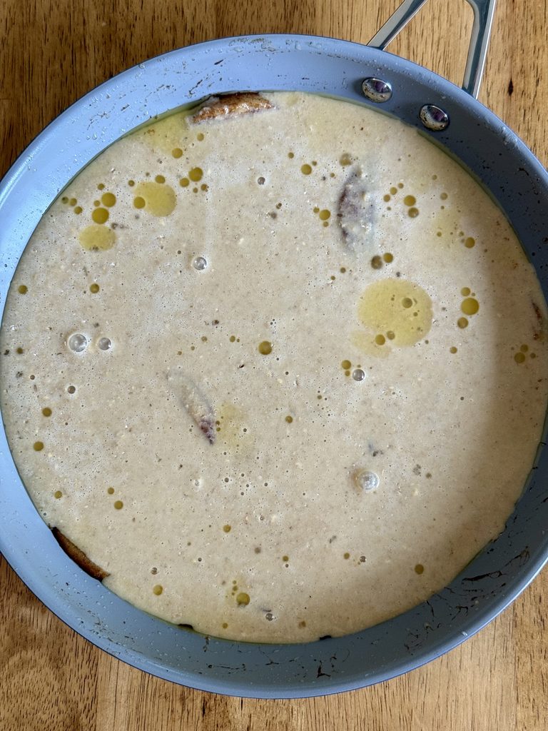 pancake batter in a skillet